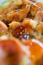 Photo, appetizing pizza with sausage, cheese, tomatoes and mayonnaise close-up,selective focus.