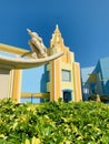 Architectural Building on a Sunny Day with Sculpture of a Girl on a Surfboard