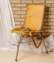 Photo of Artist tool box. Painter`s case with portable easel. Th