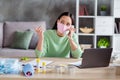 Photo of asian busy business lady organizing facial flu medical masks packs for delivering boxes speaking pick up Royalty Free Stock Photo
