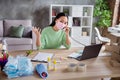 Photo of asian lady business organizing facial flu medical masks packs for delivering boxes chatting speaking landline Royalty Free Stock Photo