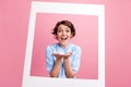 Photo of astonished cheerful lady arms hold show object paper album set card isolated on pink color background