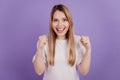 Photo of astonished excited lady celebrate victory raise fists wear casual t-shirt