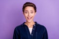 Photo of astonished millennial short hairdo lady open mouth wear jeans shirt isolated on violet color background
