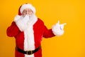 Photo astonished overweight santa claus impressed magic miracle x-mas adverts point index finger copyspace close cover