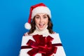 Photo of astonished positive lady wear cozy warm ugly jumper rejoice get saint nicholas gift isolated on blue color Royalty Free Stock Photo