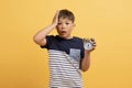 Photo of astonished shocked schoolboy feel frustrated hold clock