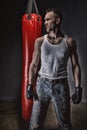 Photo of athlete and red boxing bag Royalty Free Stock Photo