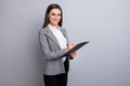 Photo of attractive business lady confident manager worker hold clipboard noting clients wishes real estate agent wear