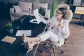 Photo of attractive business lady legs high-heels on desktop table remote work resting drink hot coffee break read