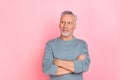 Photo of attractive dreamy retired man wear grey shirt arms folded looking empty space isolated pink color background Royalty Free Stock Photo