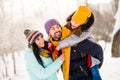 Photo of attractive family mom dad daughter piggyback happy positive smile snowy winter day walk park