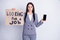 Photo of attractive fired upset manager lady hold telephone carton placard seek job prepare gadget to receive call