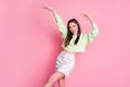 Photo of attractive funky youngster millennial lady raise arms dancing students party slim figure wear casual green crop