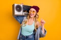 Photo of attractive lady long hairdo good mood free time hold shoulder vintage tape recorder wear casual turquoise