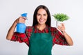 Photo of attractive nice young woman hold potted plant garden hold spray isolated on grey color background