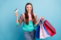 Photo of attractive pretty nice lovely lady holding many colorful bags in hand showing easy way of payment Royalty Free Stock Photo