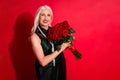 Photo of attractive retired white haired lady luxury rich person hold big bunch roses joyful present surprise family Royalty Free Stock Photo