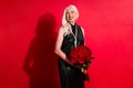 Photo of attractive retired white haired lady luxury rich person movie star hold big bunch roses fans present red carpet