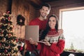 Photo of attractive sweet family husband wife wear ugly sweaters relax rest enjo magic moments christmas time using Royalty Free Stock Photo