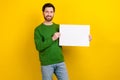 Photo of attractive wear green sweater stand demonstration protest show empty space white placard isolated on yellow