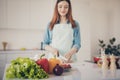 Photo of attractive wife making perfect supper for family cut hen meat clean vegetables focus Royalty Free Stock Photo