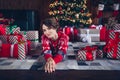 Photo of attractive young woman lying floor have rest cute dressed red sweater christmas room interior design tree Royalty Free Stock Photo