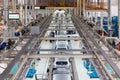 Photo of automobile production line. Modern car assembly plant. Modern and high-tech automotive industry. Conveyor of