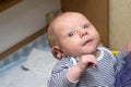 Photo of baby with big blue eyes, which is held by mother Royalty Free Stock Photo