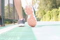 young woman Jogging in the park in the morning under warm sunlight