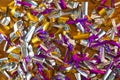 Photo background of rectangular confetti made of purple and gold foil on the wooden background Royalty Free Stock Photo