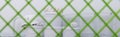 Photo background taken through a grid, a set of tools for painting walls, rollers, buckets of paint and a protective helmet Royalty Free Stock Photo