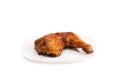 Photo baked chicken leg on a plate
