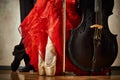 Photo of ballet pointe and latin dancers shoes and cello