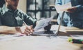 Photo bearded businessman working with new project. Generic design notebook on wood table. Analyze plans hands Royalty Free Stock Photo