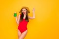 Photo of beautiful amazing lady nice colorful look green alcohol beverage chill wear sun hat red swimming suit isolated