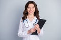 Photo of beautiful cheerful professional doc practitioner intern lady hold patient papers medical prescriptions wear