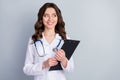 Photo of beautiful cheerful professional doc practitioner lady hold patient papers medical prescriptions look interested