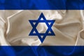 Photo of the beautiful colored national flag of the modern state of Israel on textured fabric, concept of tourism, economics and