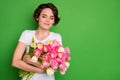 Photo of beautiful cute lady wavy short hairdo hold big tulips surprise bunch present secret admirer eyes closed