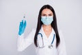 Photo of beautiful doc lady ready for operation young professional surgeon hold anesthesia syringe wear mask gloves Royalty Free Stock Photo