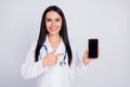Photo of beautiful doc lady show patient direct finger smart phone telephone showing online prescription form wear