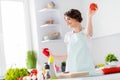 Photo of beautiful funny housewife hold fresh tomato pepper bell good mood morning tasty breakfast dancing and cooking