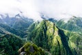 Green cloud-covered mountain peaks on Madeira Island