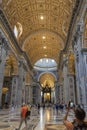 Photo of the beautiful interior of the imposing Saint Peter`s Basilica in Rome, with the Tomb of Saint Peter in the back Royalty Free Stock Photo