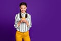 Photo of beautiful lady holding telephone writing new instagram post positive good mood wear striped shirt yellow