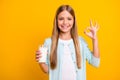 Photo of beautiful little blond lady hold arm fresh milk glass show okey symbol advising drink dairy products every Royalty Free Stock Photo