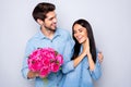 Photo of beautiful nice cute couple of two people girlfriend rejoicing with receiving bouquet of fuchsia flowers and