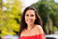 Photo of beautiful positive young happy woman nice smile good mood stand outside in city park outdoors