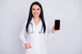 Photo of beautiful professional doc lady show patient low price smart phone telephone with online prescription test wear